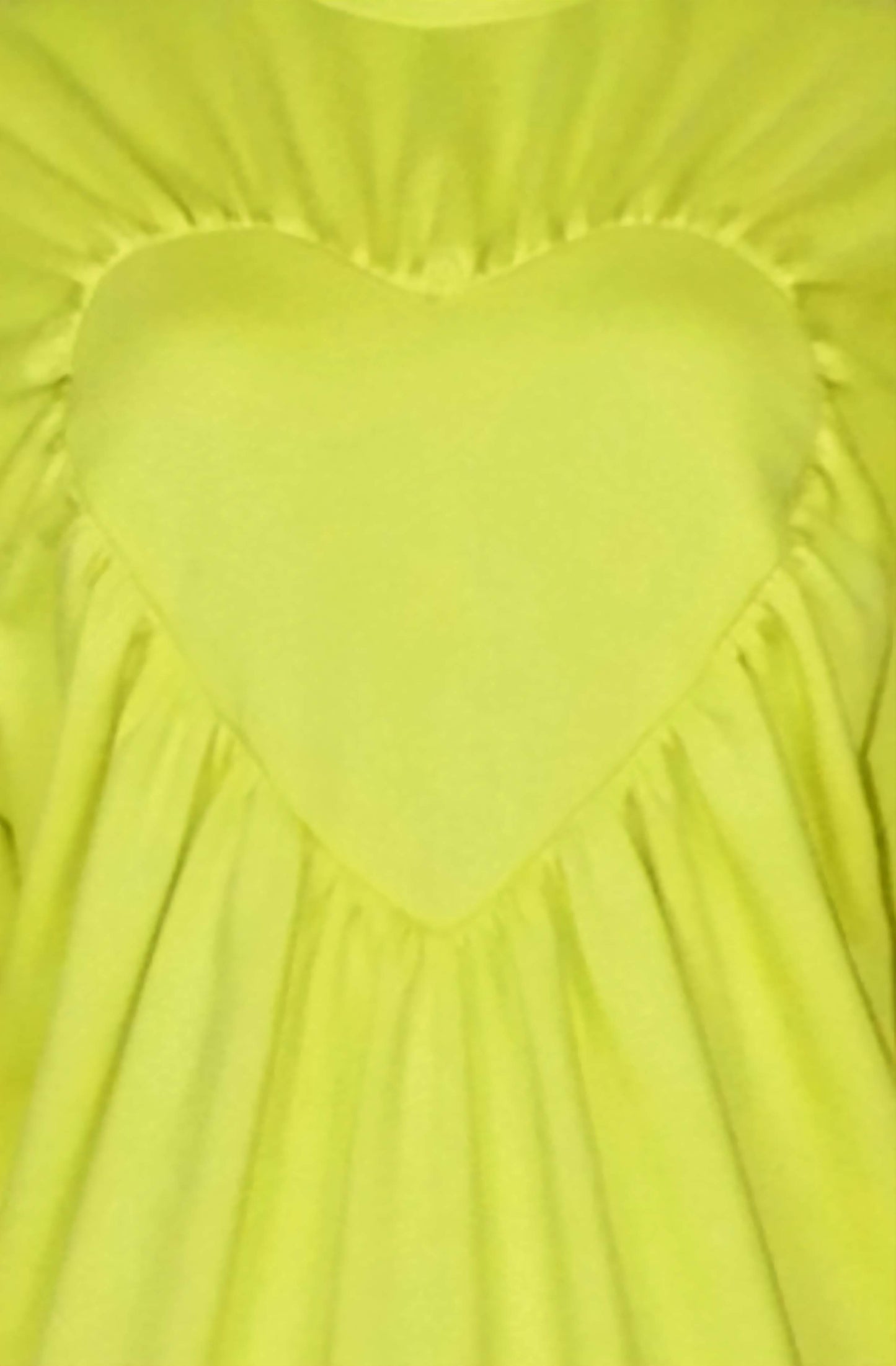 Close-up zoom of the heart sweater with gathered edges made with love in Great Britain