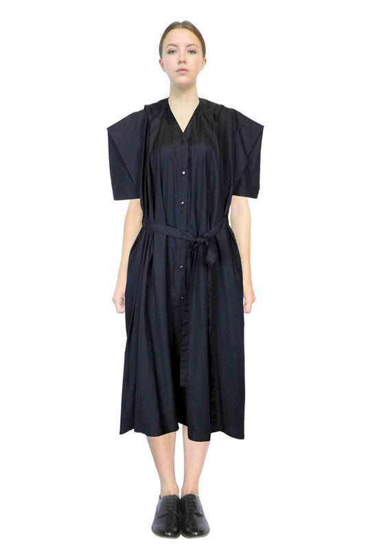 The farmers dress is a luxury designer garment with loose front drapes and unique tailored back with kimono sleeves made in black cotton.