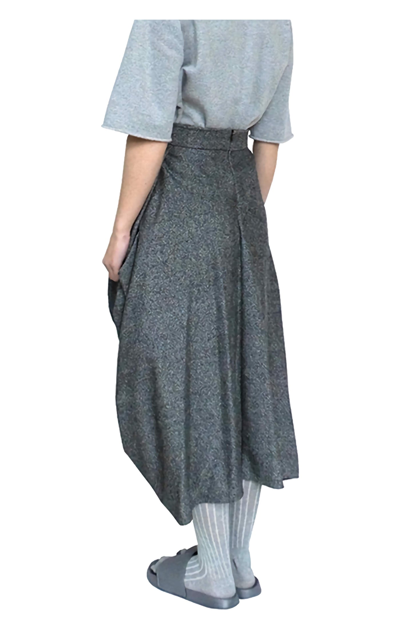 Side view of the knotted skirt made in luxury abraham moon and sons traditional heritage wool.