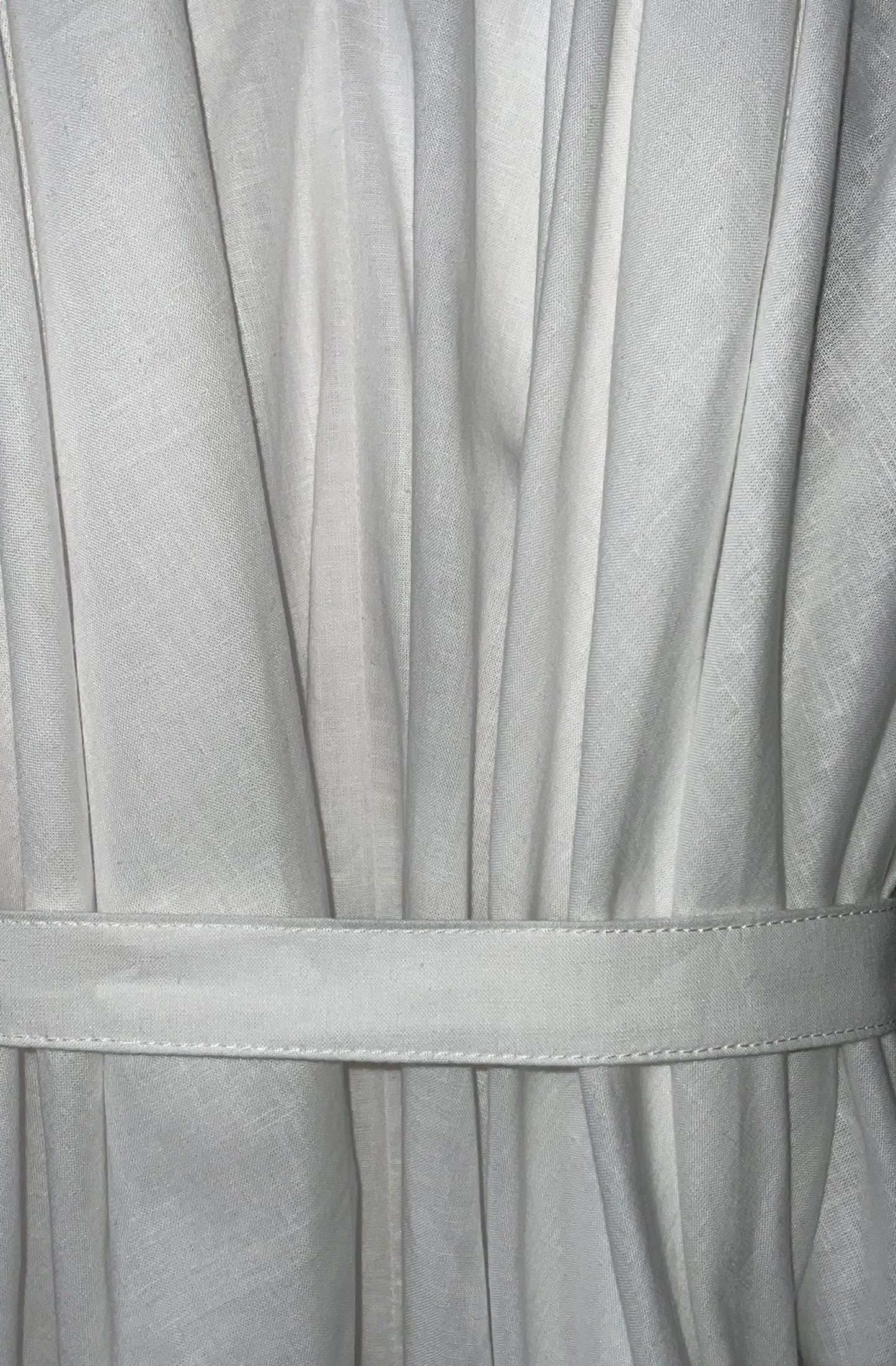 Close-up of the white zero waste knotted dress with a belt made in UK