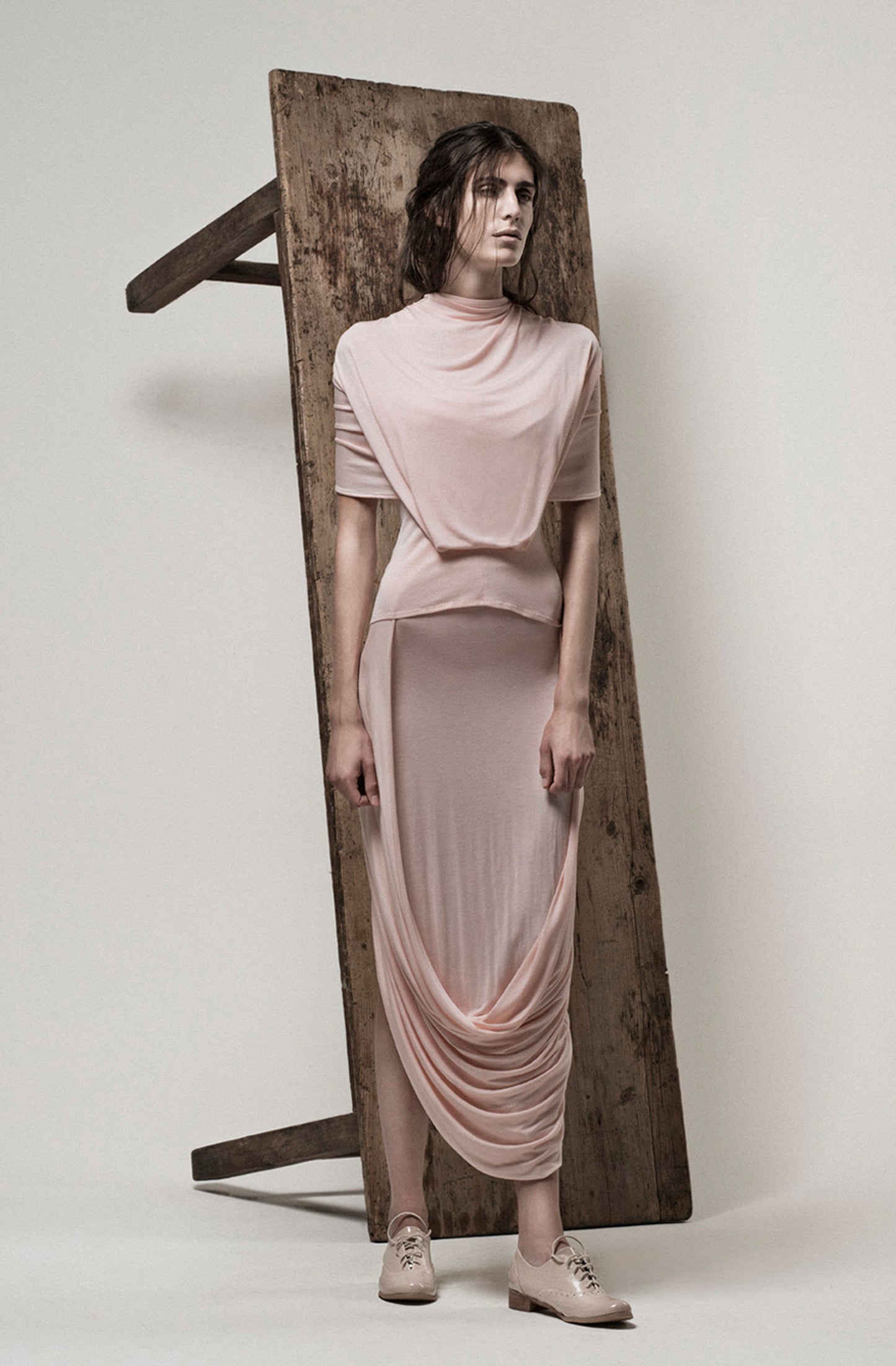 Zero-waste pink loop skirt styled with matching top, sustainable luxury fashion UK