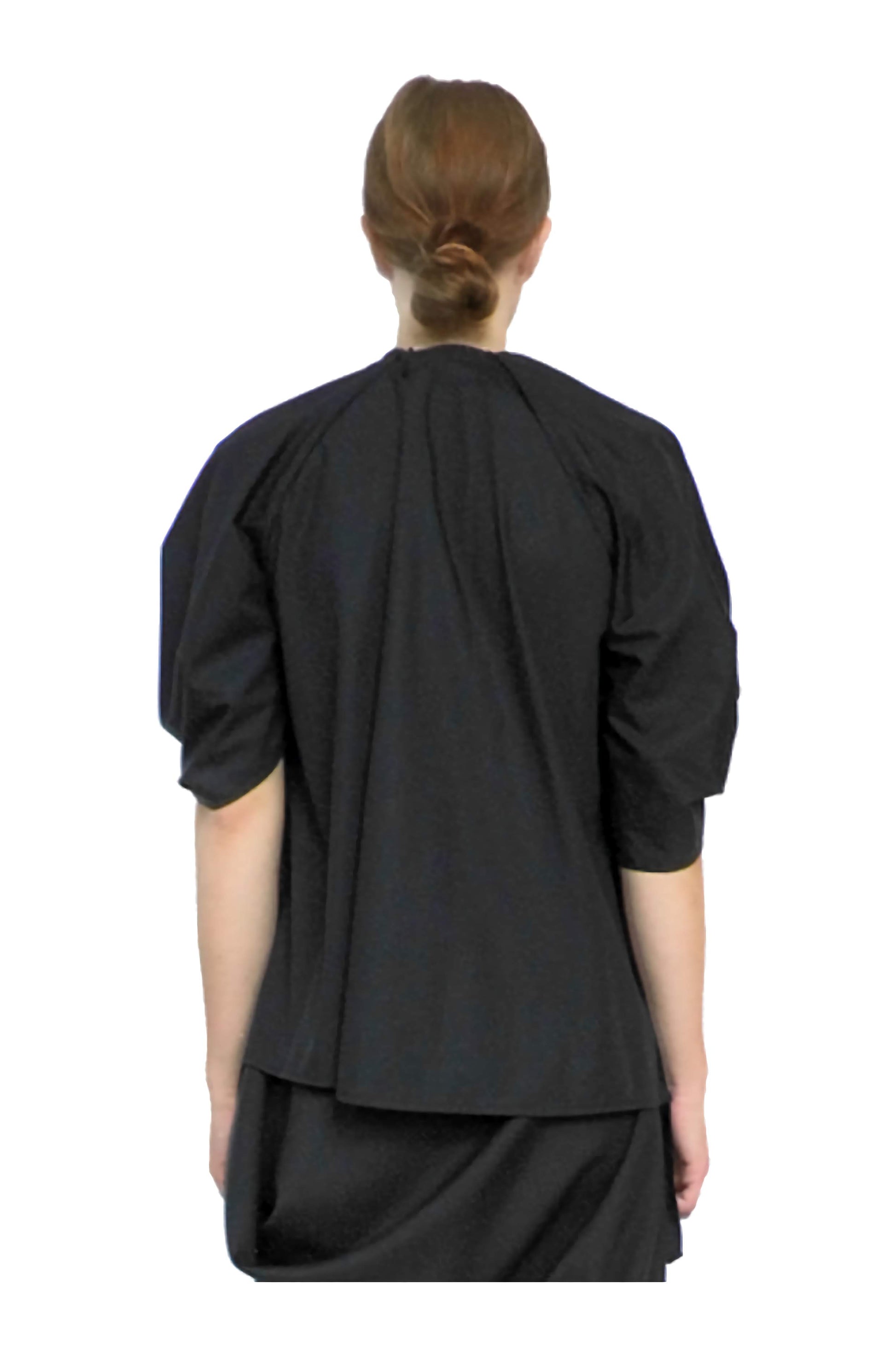 Fashionable back view of the avant-garde luxury designer rosette blouse top