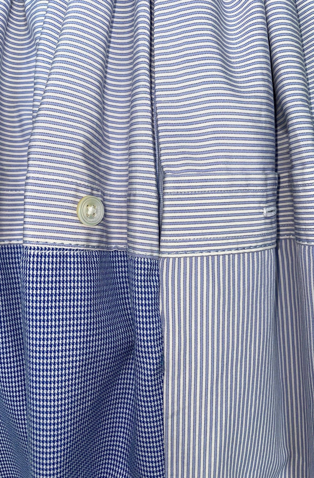 Recycled stripe shirt skirt close up of the side hip pocket.