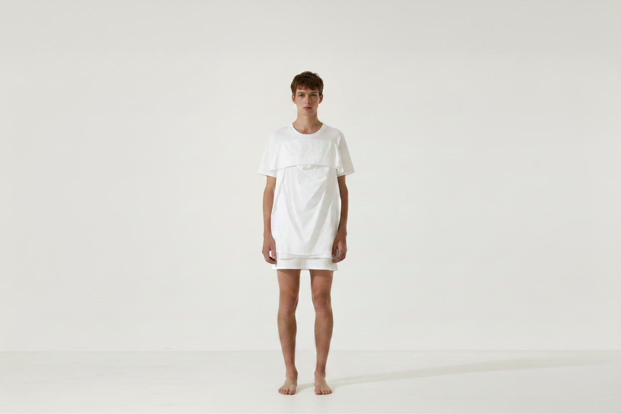 Model wearing white unisex t-shirt dress in minimal studio — Cunnington & Sanderson sustainable unisex fashion