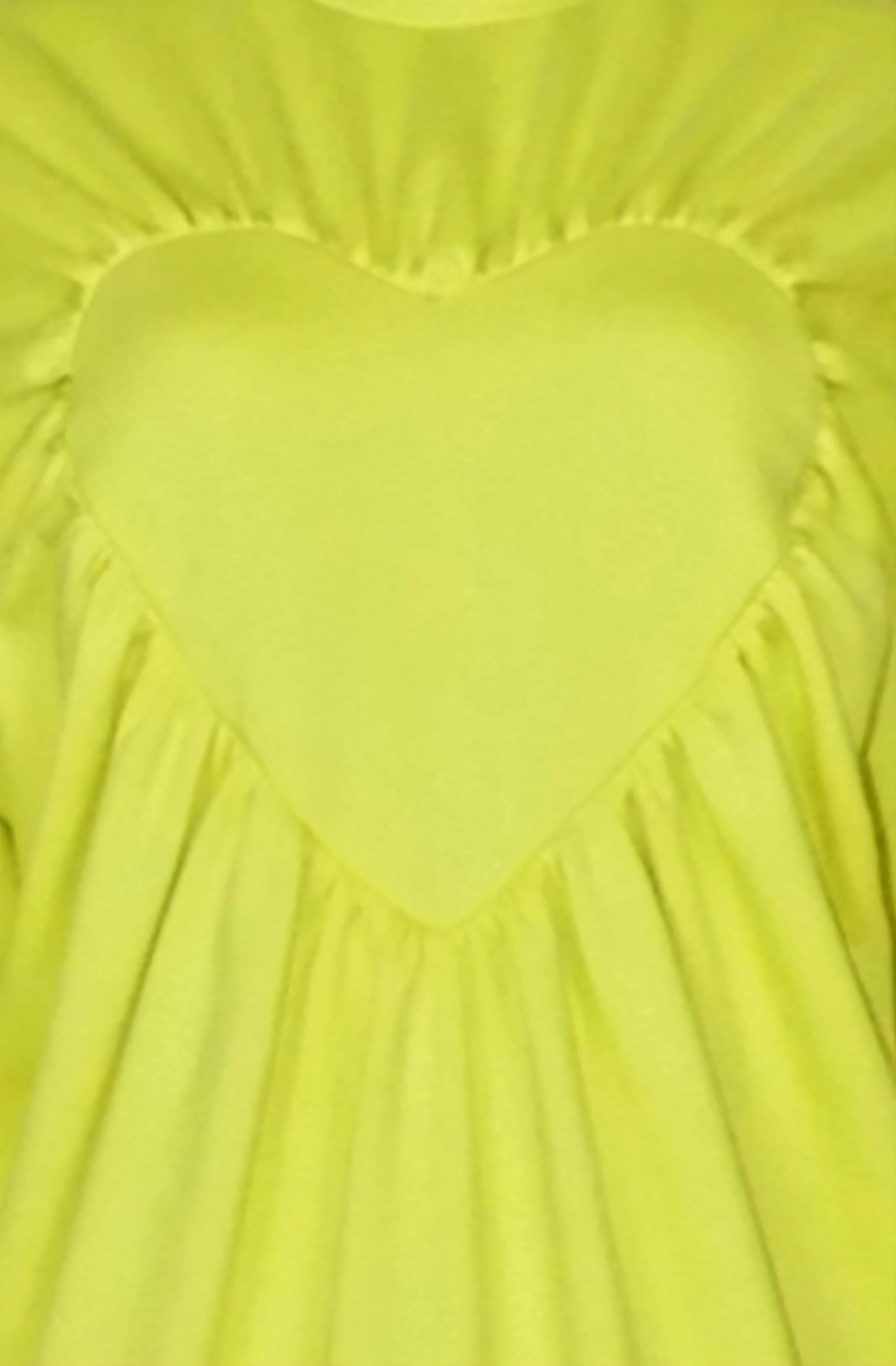 Close-up zoom of the heart sweater with gathered edges made with love in Great Britain