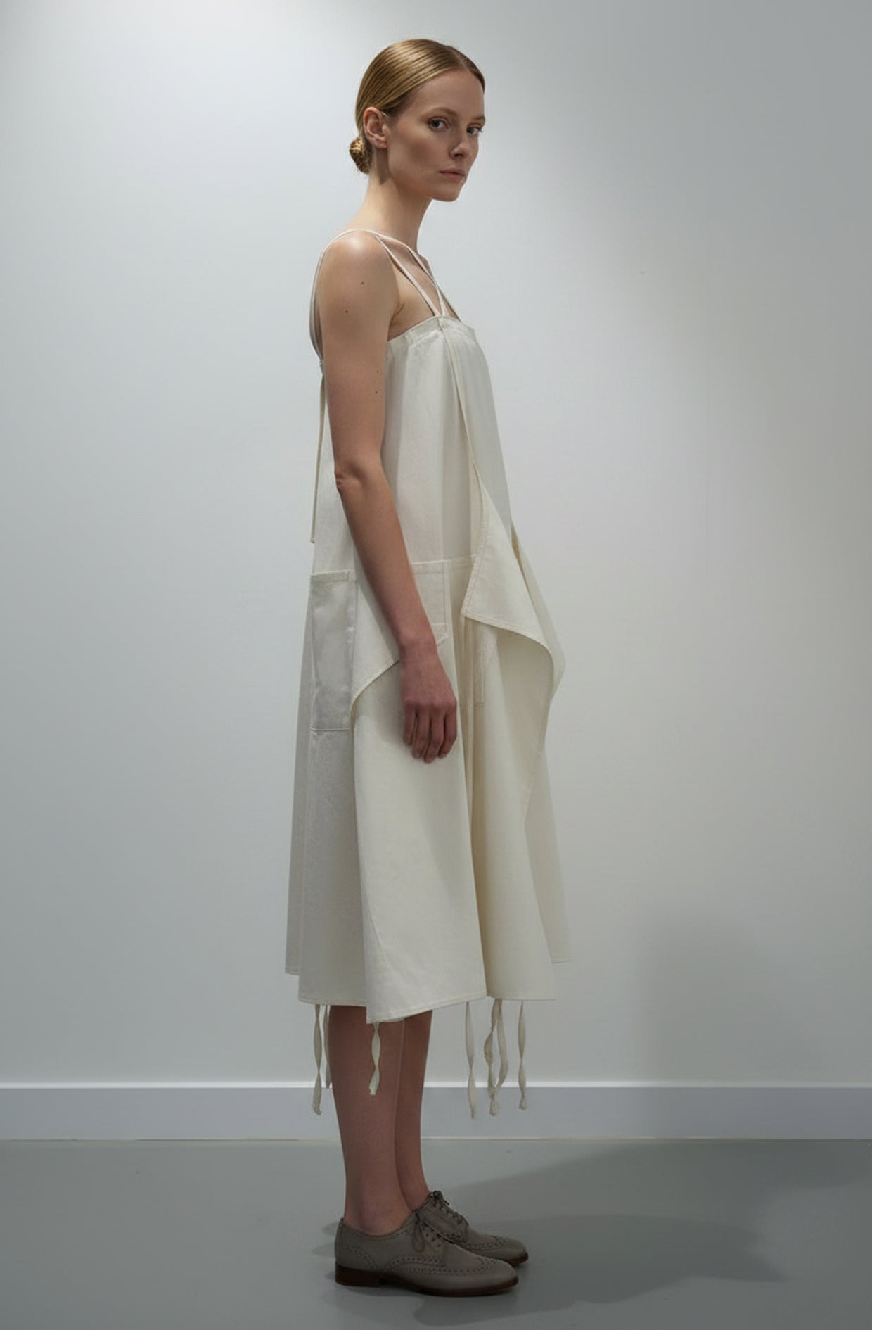 Aprons Dress side view — five-apron zero-waste design by Cunnington & Sanderson
