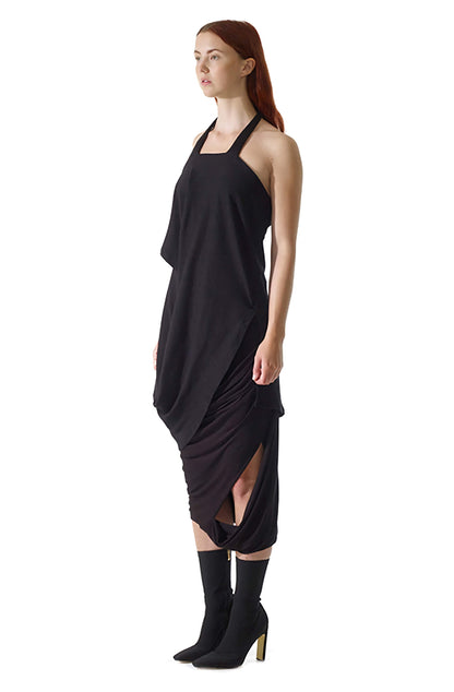 Side view of zero-waste black viscose jersey missing skirt with asymmetric cutout, sustainable luxury made-to-order in UK