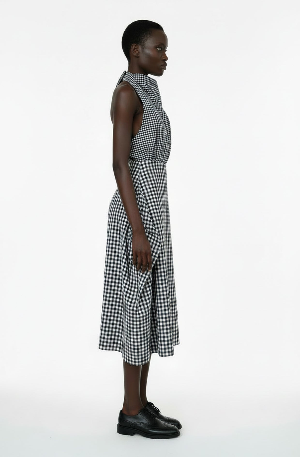 Zero waste cotton blanket skirt with architectural folds and hidden pockets, sustainable luxury made in UK