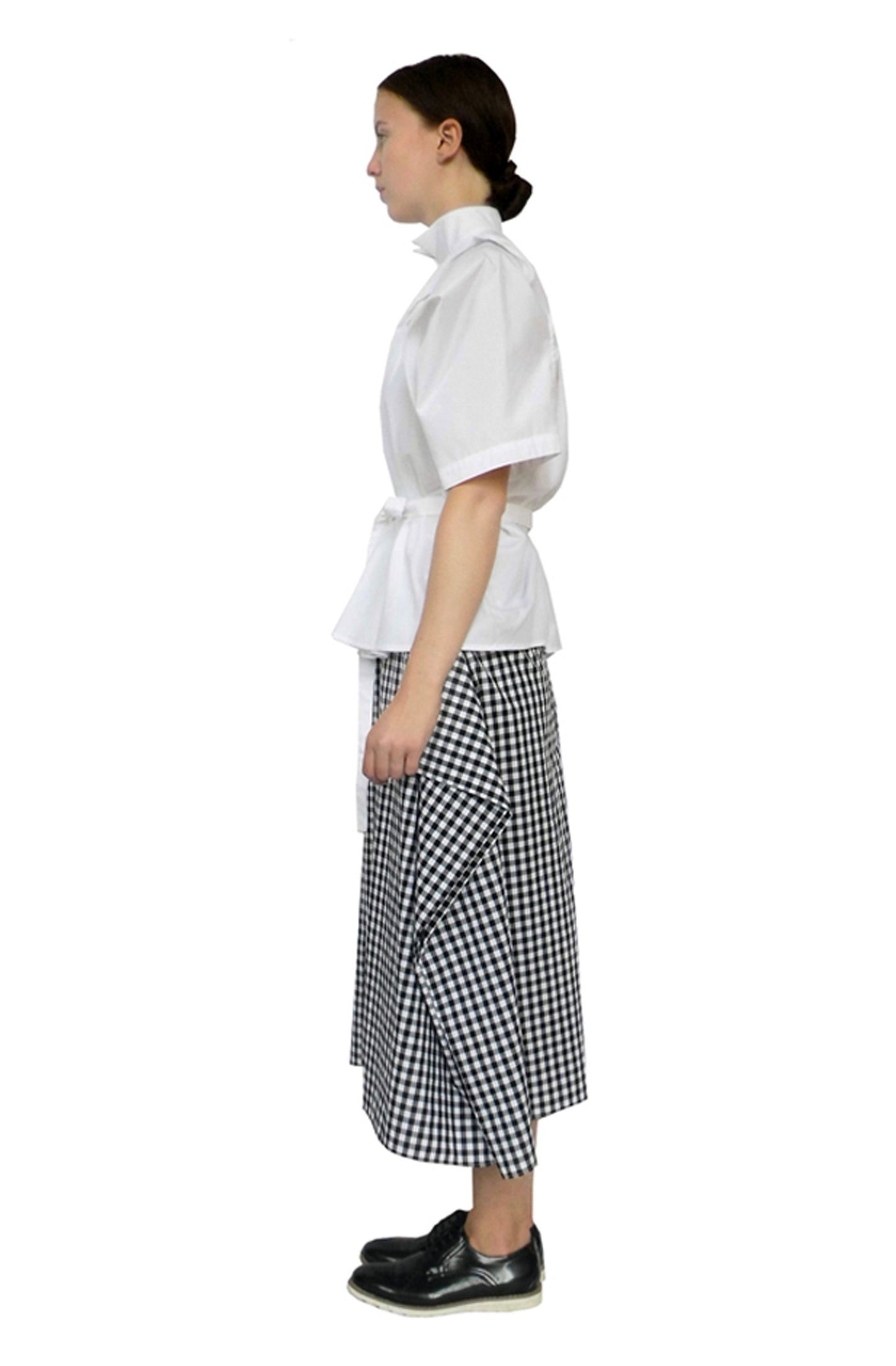 Zero-waste cotton blanket skirt with architectural folds and hidden pockets, sustainable luxury made in UK