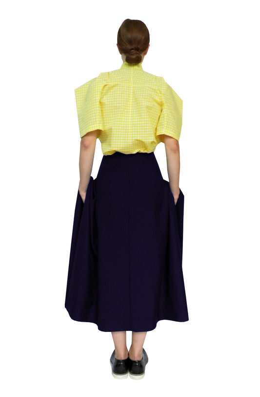 Sustainable fashion blanket pocket skirt has large pockets and luxurious fabric folds