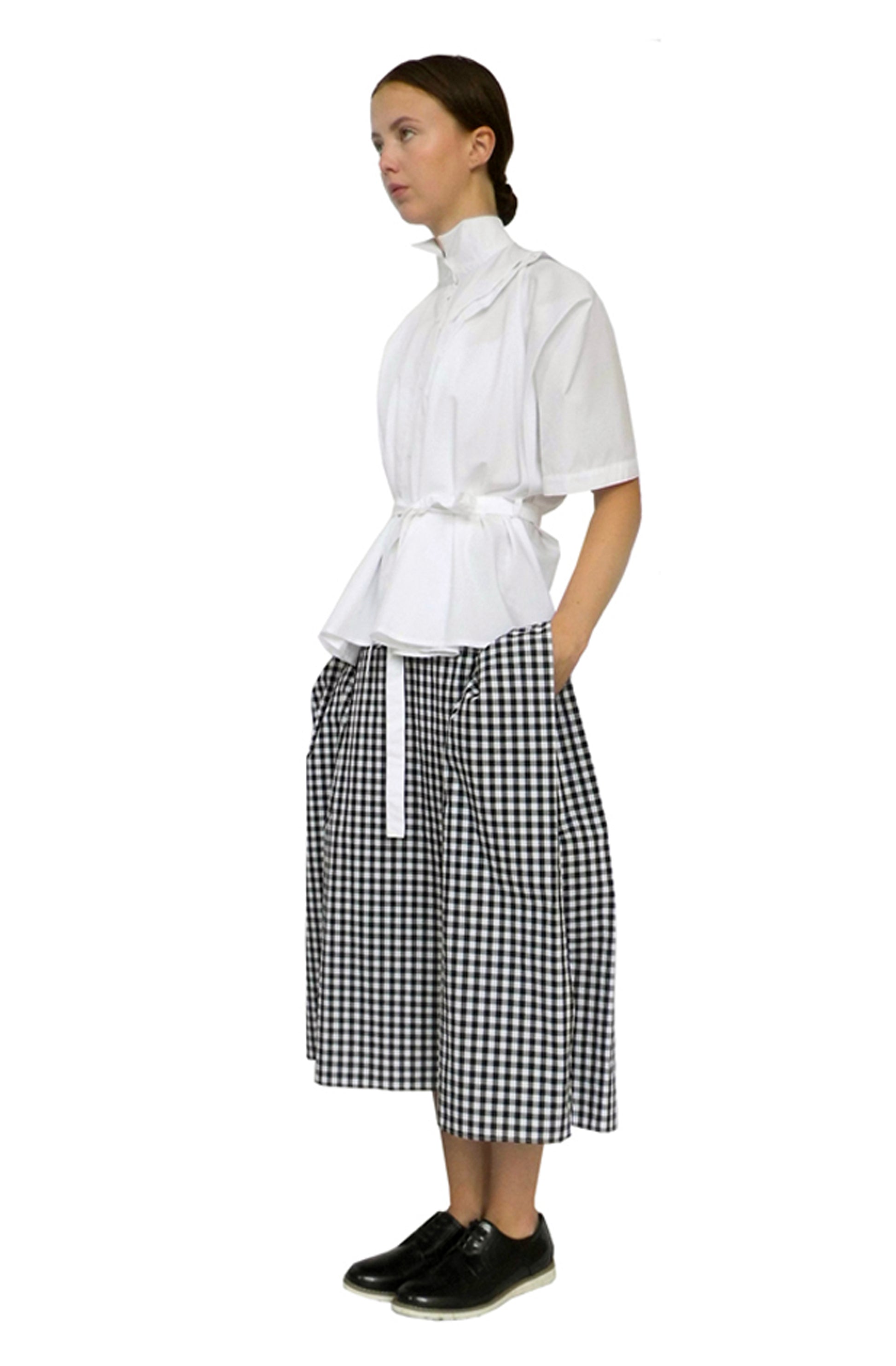 Zero-waste gingham cotton blanket skirt with boxy silhouette and hidden pockets, sustainable midi luxury made in UK
