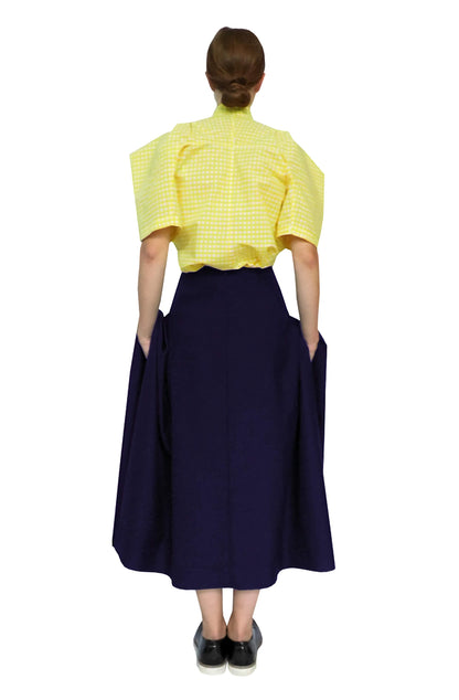 Sustainable fashion blanket pocket skirt has large pockets and luxurious fabric folds