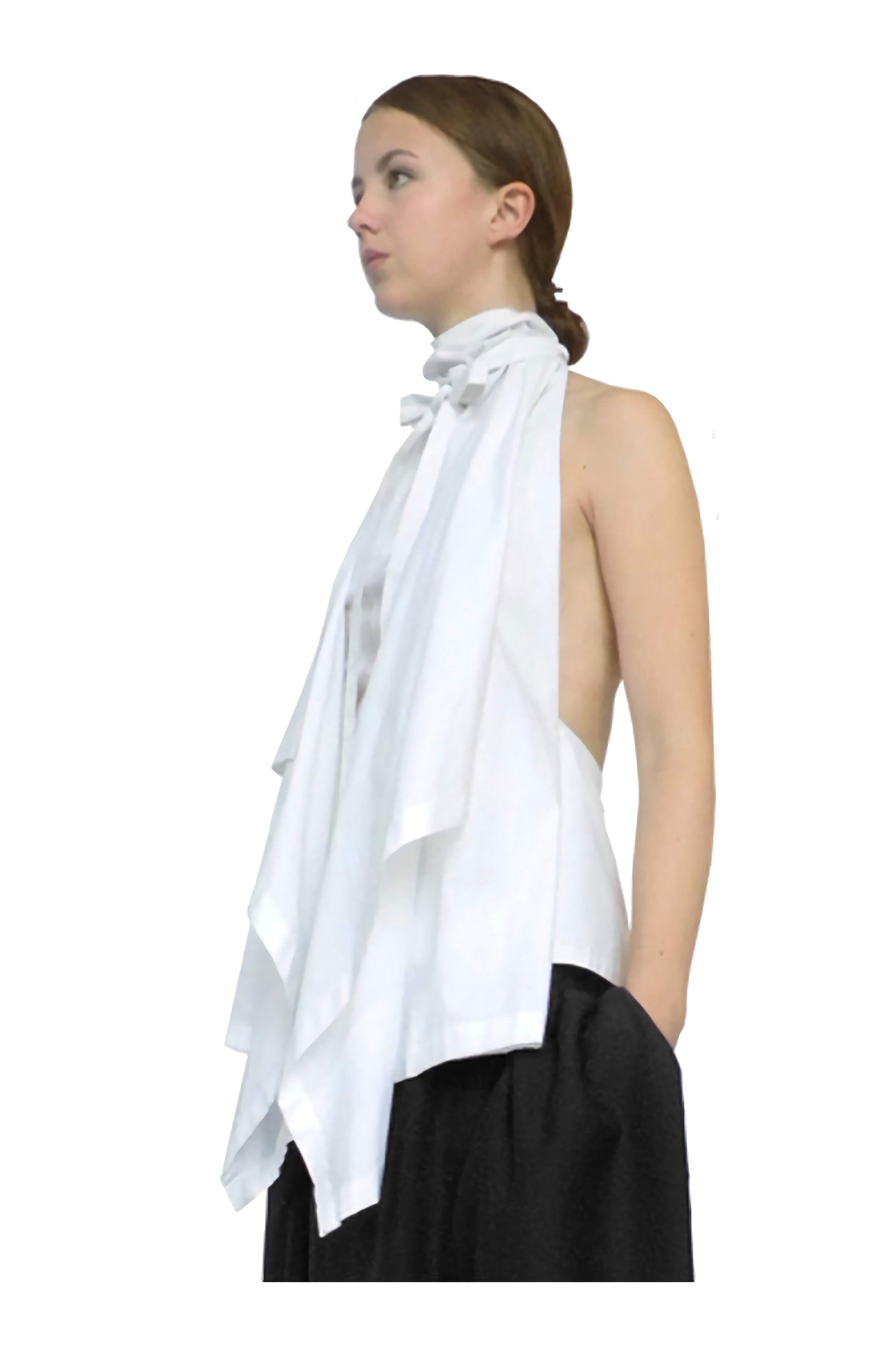 Female model wears chic white blanket top by British designer brand Cunnington & Sanderson