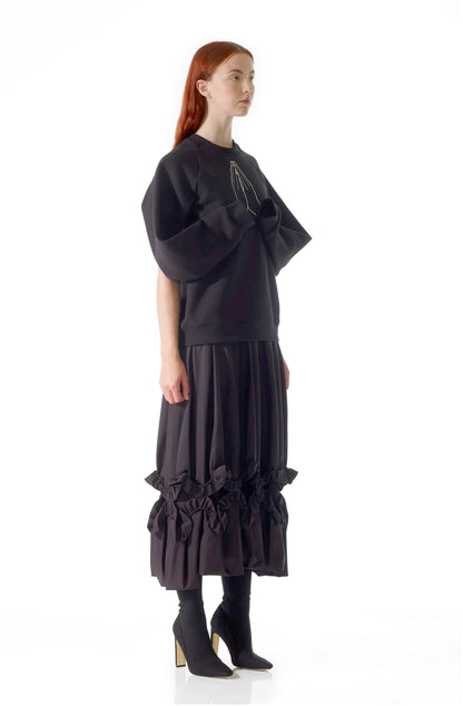 Chandelier skirt side view showing ruffle detail, zero-waste black cotton made-to-order UK