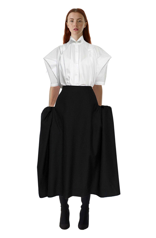 Black cotton blanket pocket skirt front view with a unique boxy silhouette