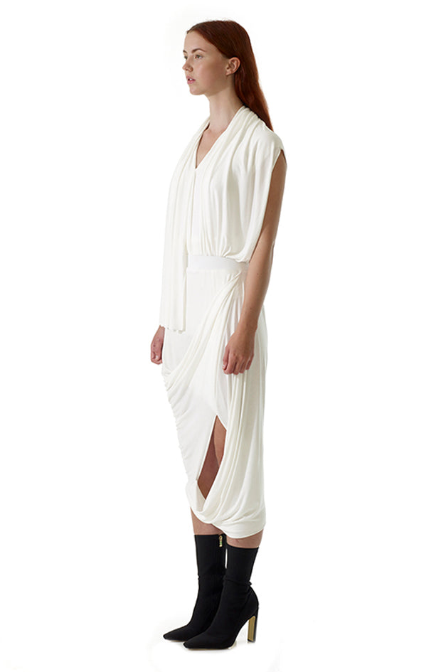 model wears designer white drape top with contemporary style silhouette and asymmetric shape