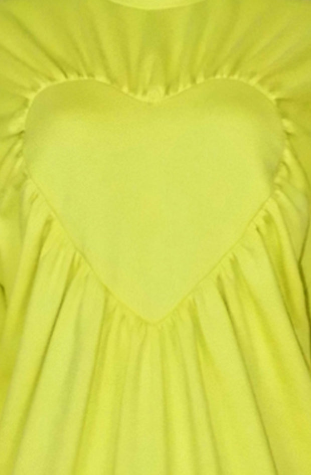 close up zoom of the bright yellow heart sweater with gathered edges made in organic cotton