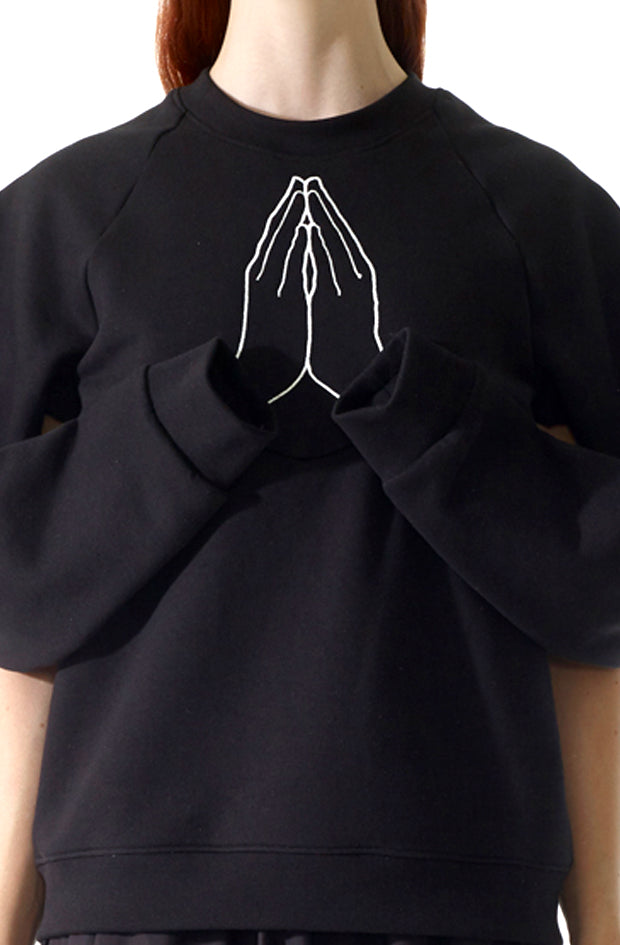 black organic cotton hope sweatshirt with draped sleeves and embroidered hands to represent hope