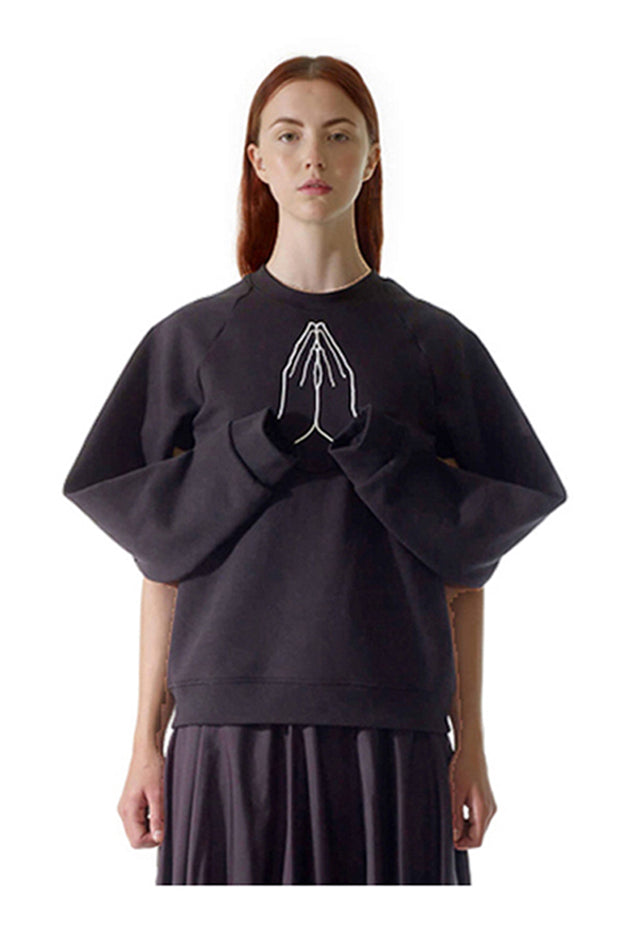 model wears award winning british brand cunnington & sanderson organic hope sweatshirt which tells the story of hope