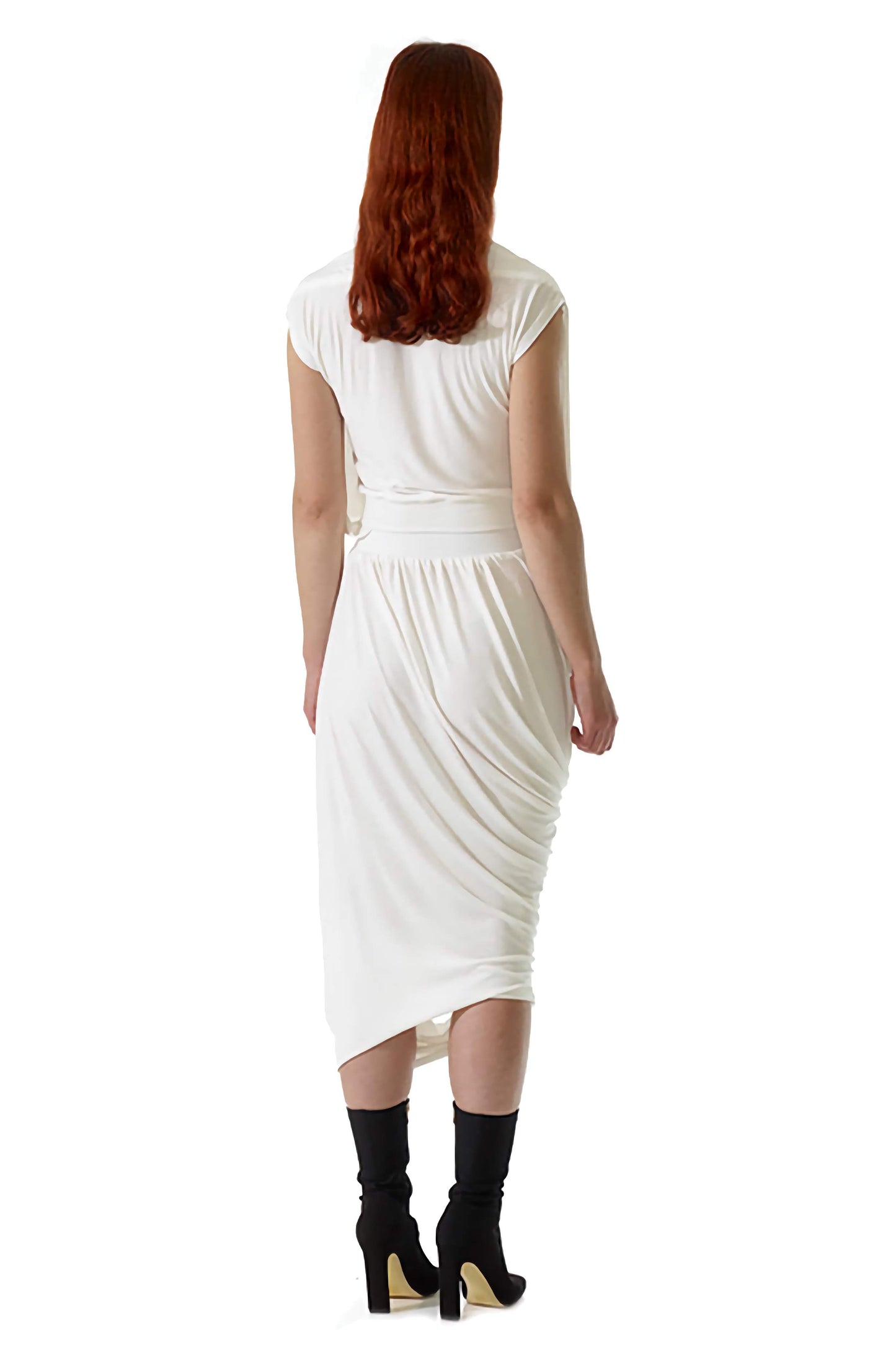 Female model wearing a flattering draped curtain top by British designers Cunnington and Sanderson