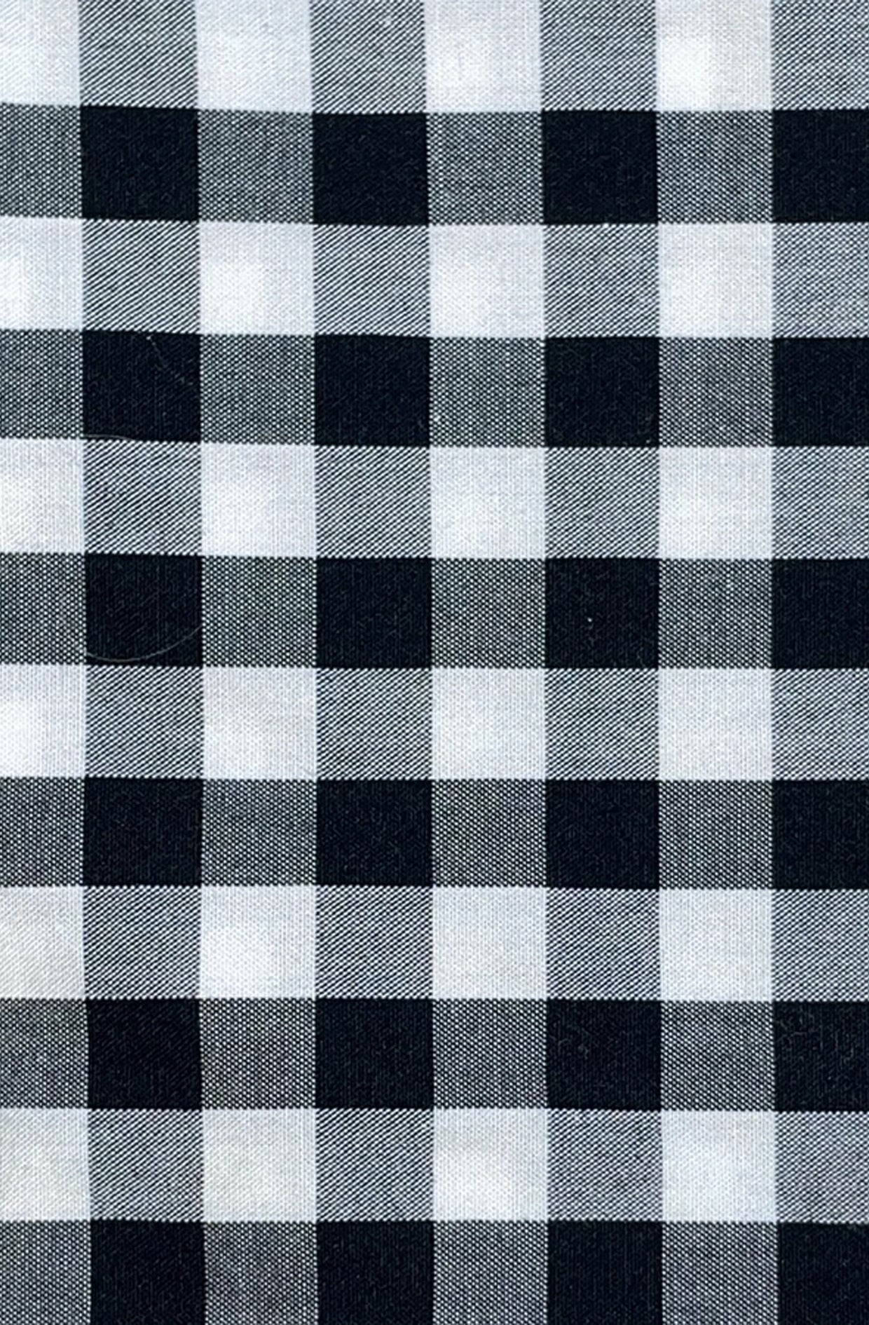 Black and white checkered gingham fabric pattern clode up detail
