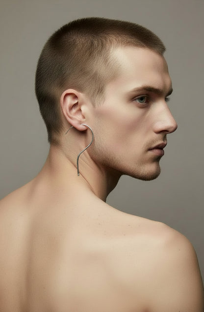 Silver question mark wire earring worn by male model, back view — minimalist silver jewellery, handmade in the Paris
