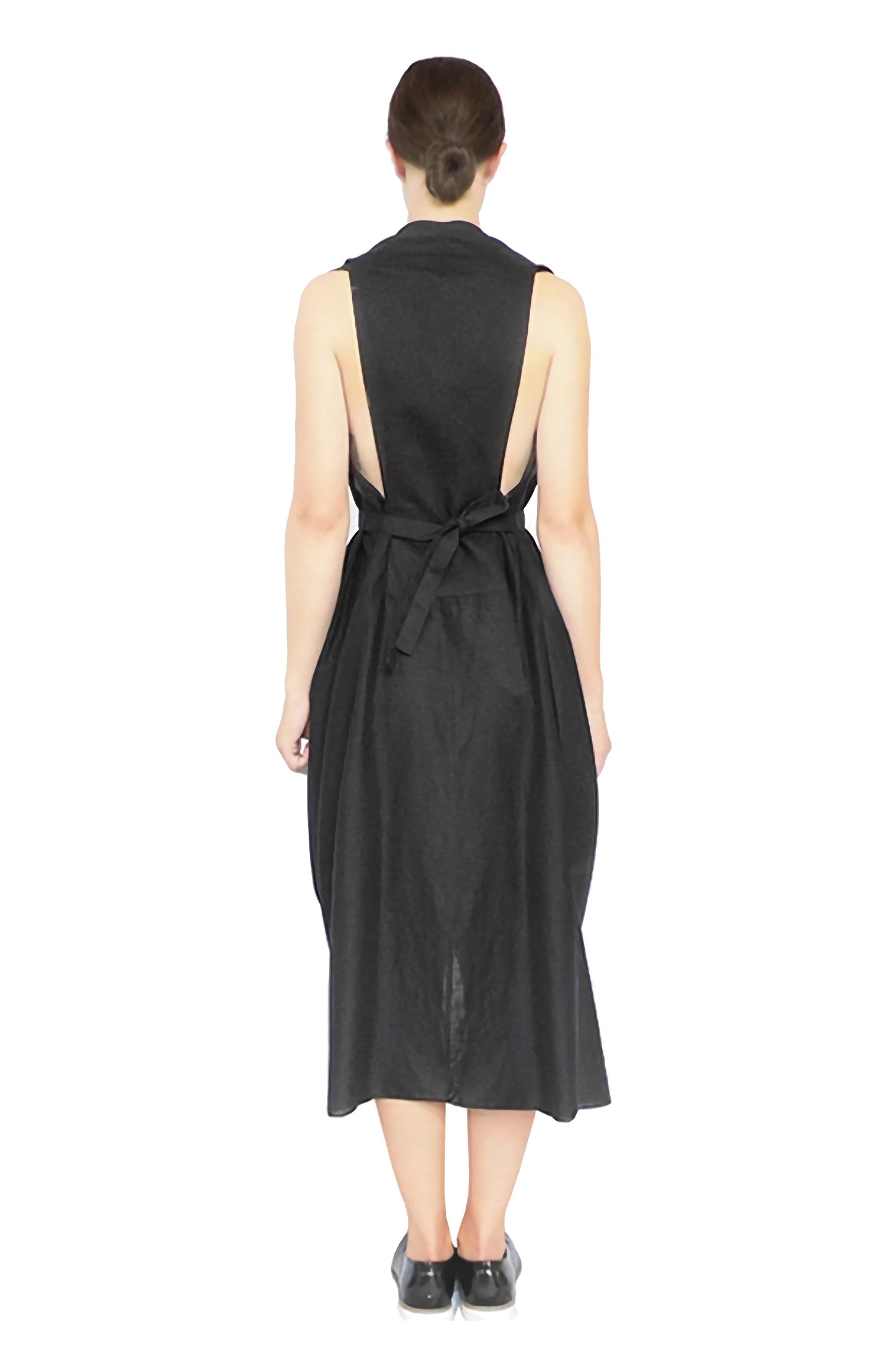 Elegant and timeless designer knotted dress showing the bespoke cut-away back, wearable art
