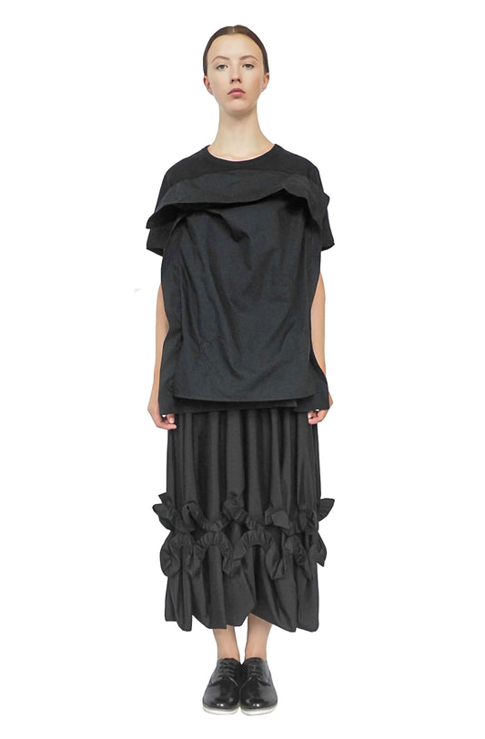 Thought-provoking black pillow top dress designed to raise mental health awareness and diversity