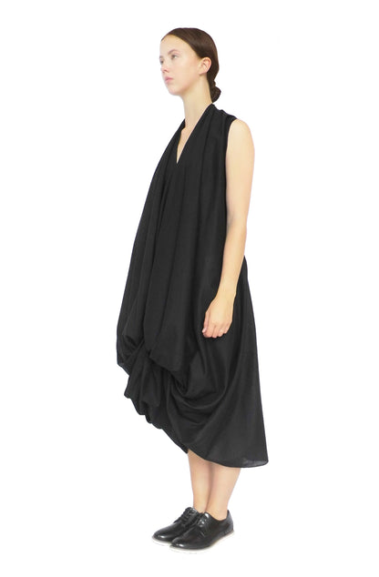 Zero-waste black cotton knotted dress with hand-draped good luck knot, sustainable artisan luxury made in UK