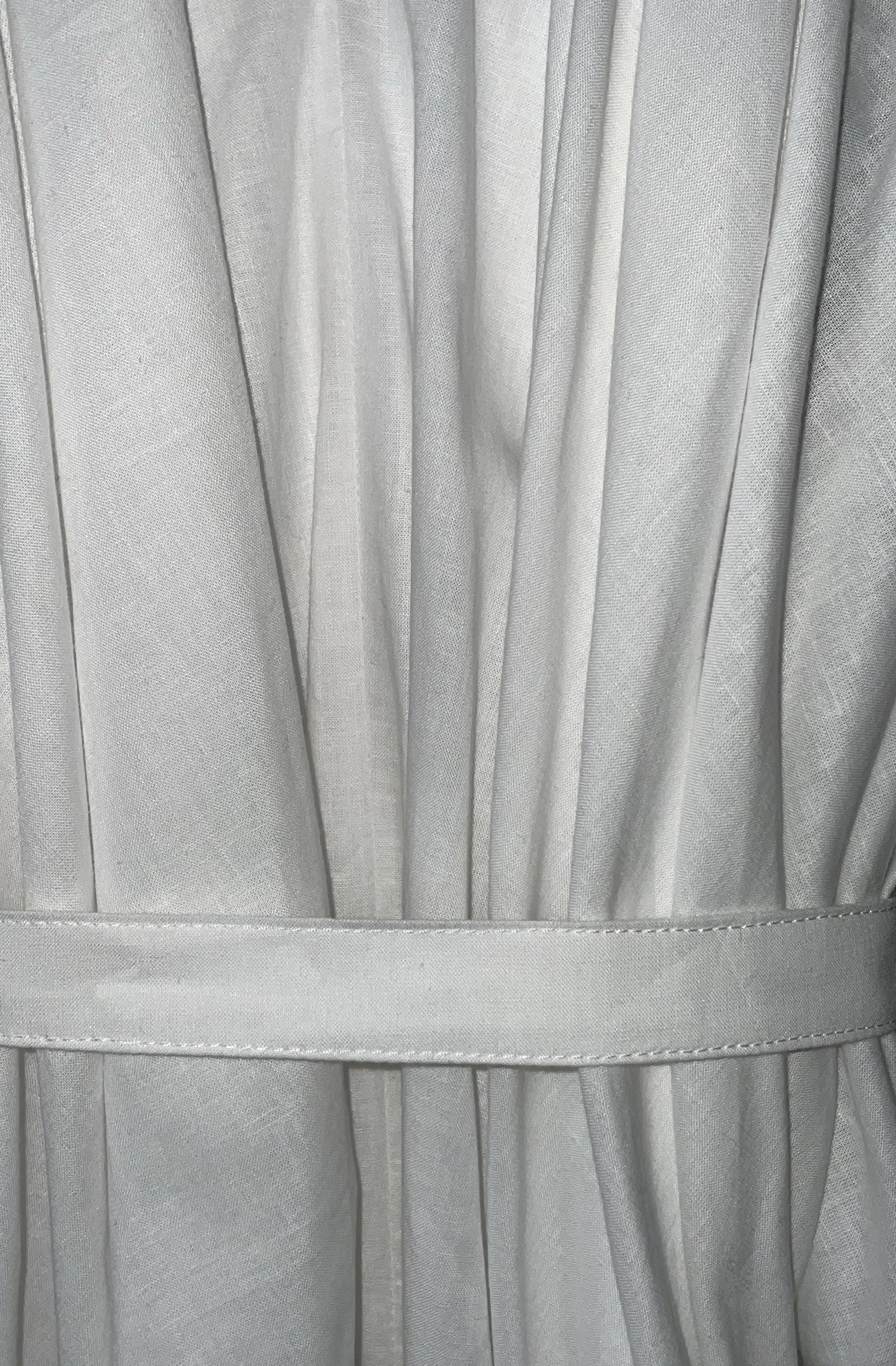 Close-up of the white zero waste knotted dress with a belt made in UK