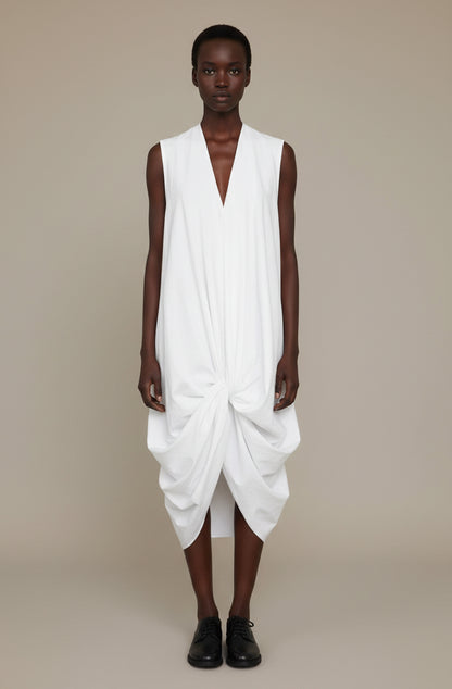 White knotted dress with crafted good luck knot structure, zero-waste sustainable made-to-order UK