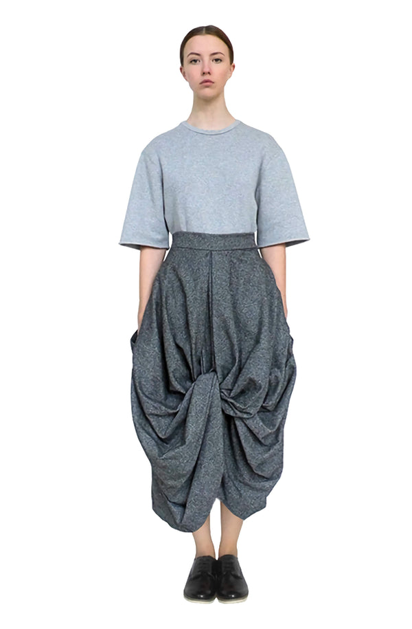 Contemporary and modern long-length drape skirt with voluminous good luck knot