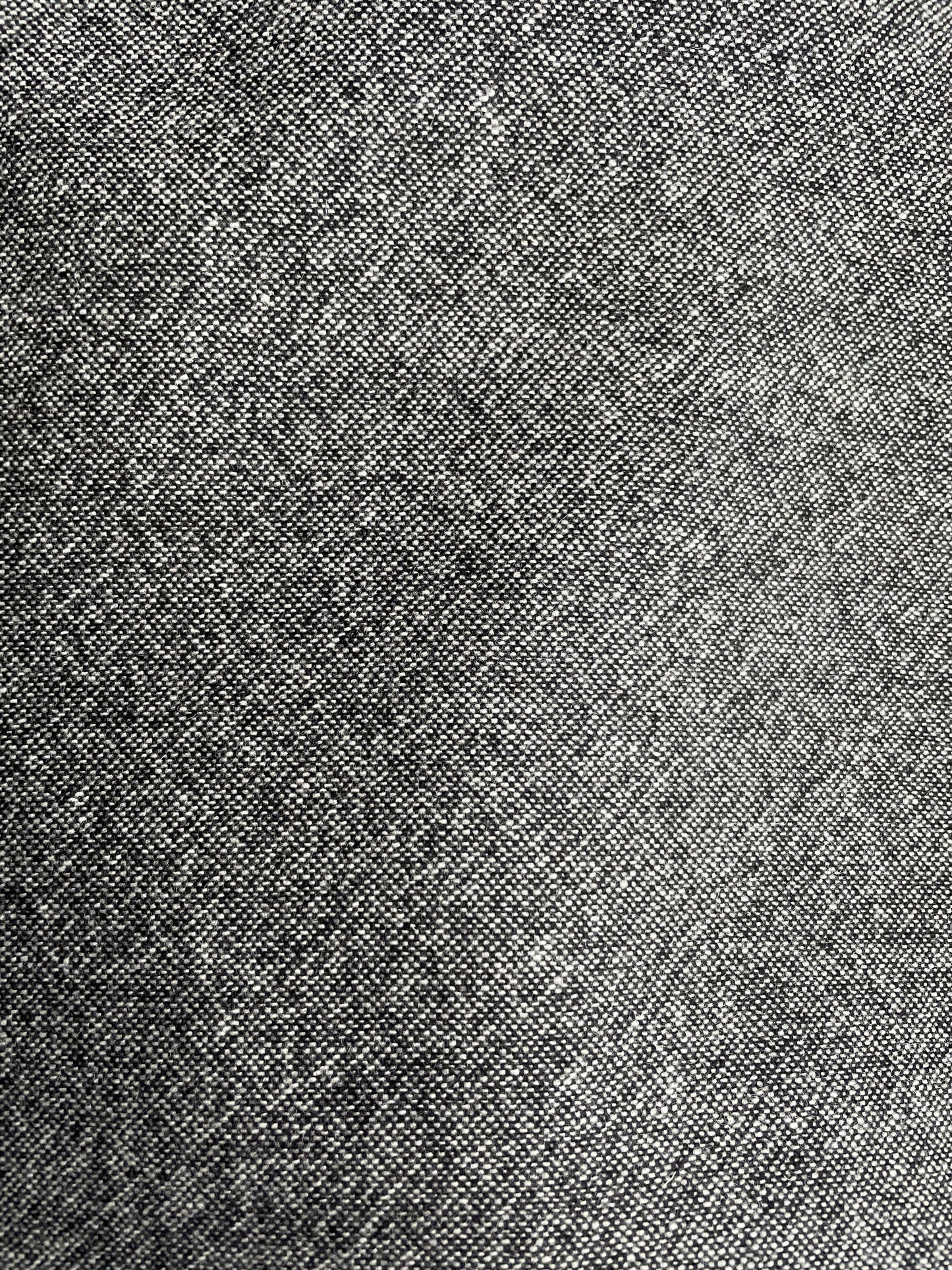 Close-up of a textured gray speckled merino wool surface from Yorkshire, UK