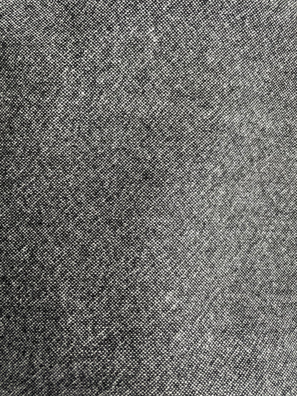 Close-up of a textured gray speckled merino wool surface from Yorkshire, UK