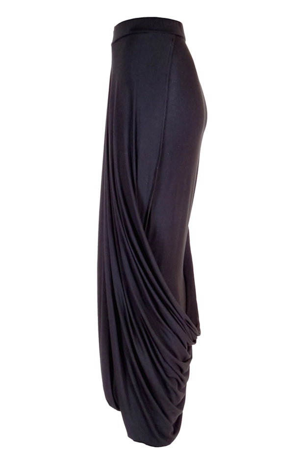 Black draped avantgarde skirt side view on a white background