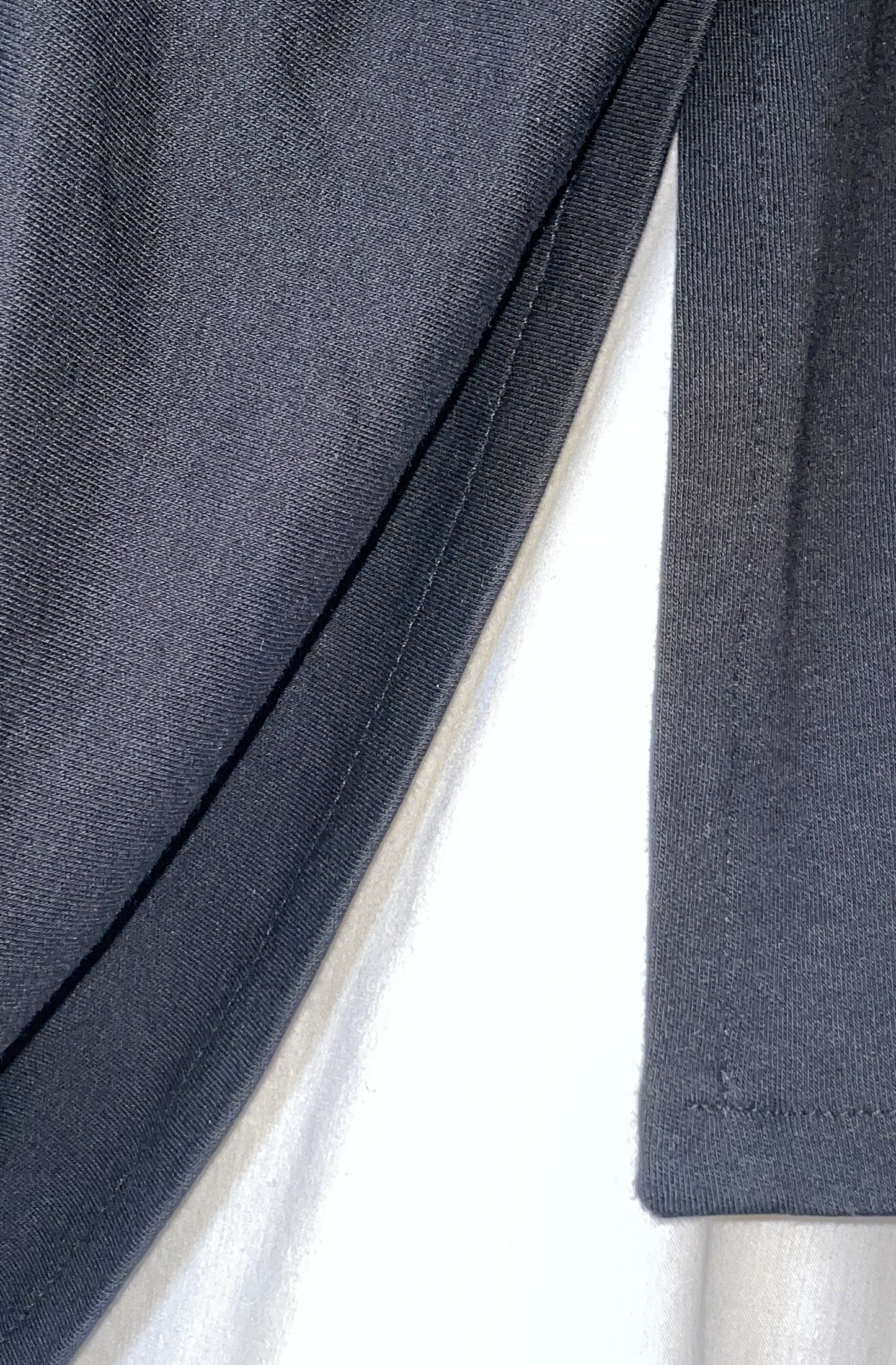 Close-up detail missing top black organic cotton zero waste high quality finish edges