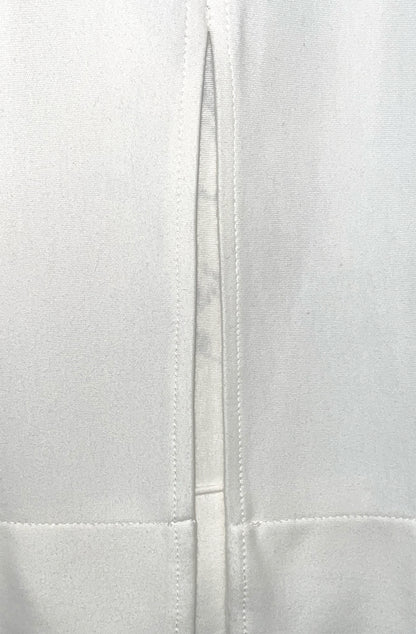 Close-up of back vent detail on white organic cotton fabric texture zero waste nettle dress