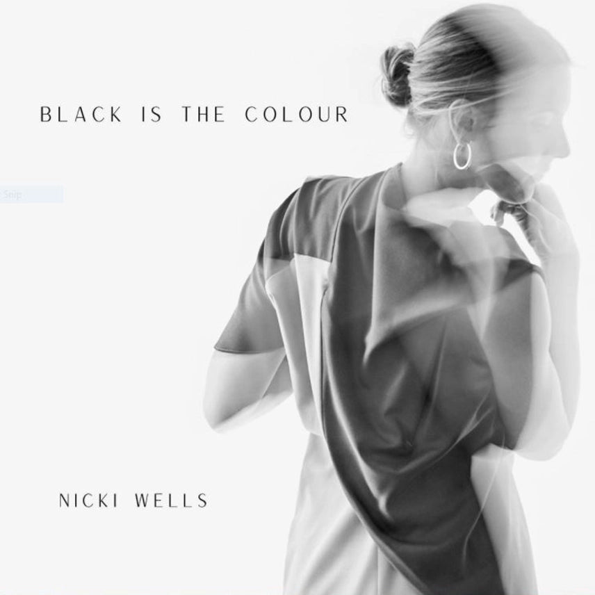 Album cover with artist singer songwriter Nicki Wells wearing the reflect dress by cunnington & Sanderson