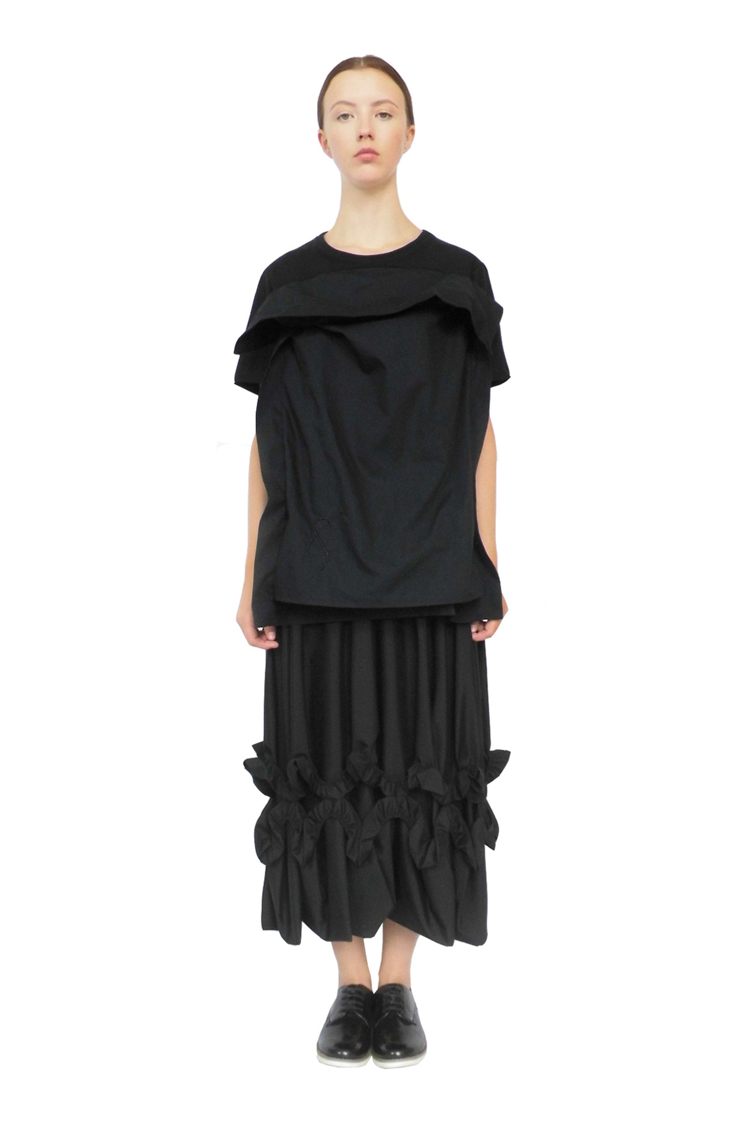 Thought-provoking black pillow top dress designed to raise mental health awareness and diversity