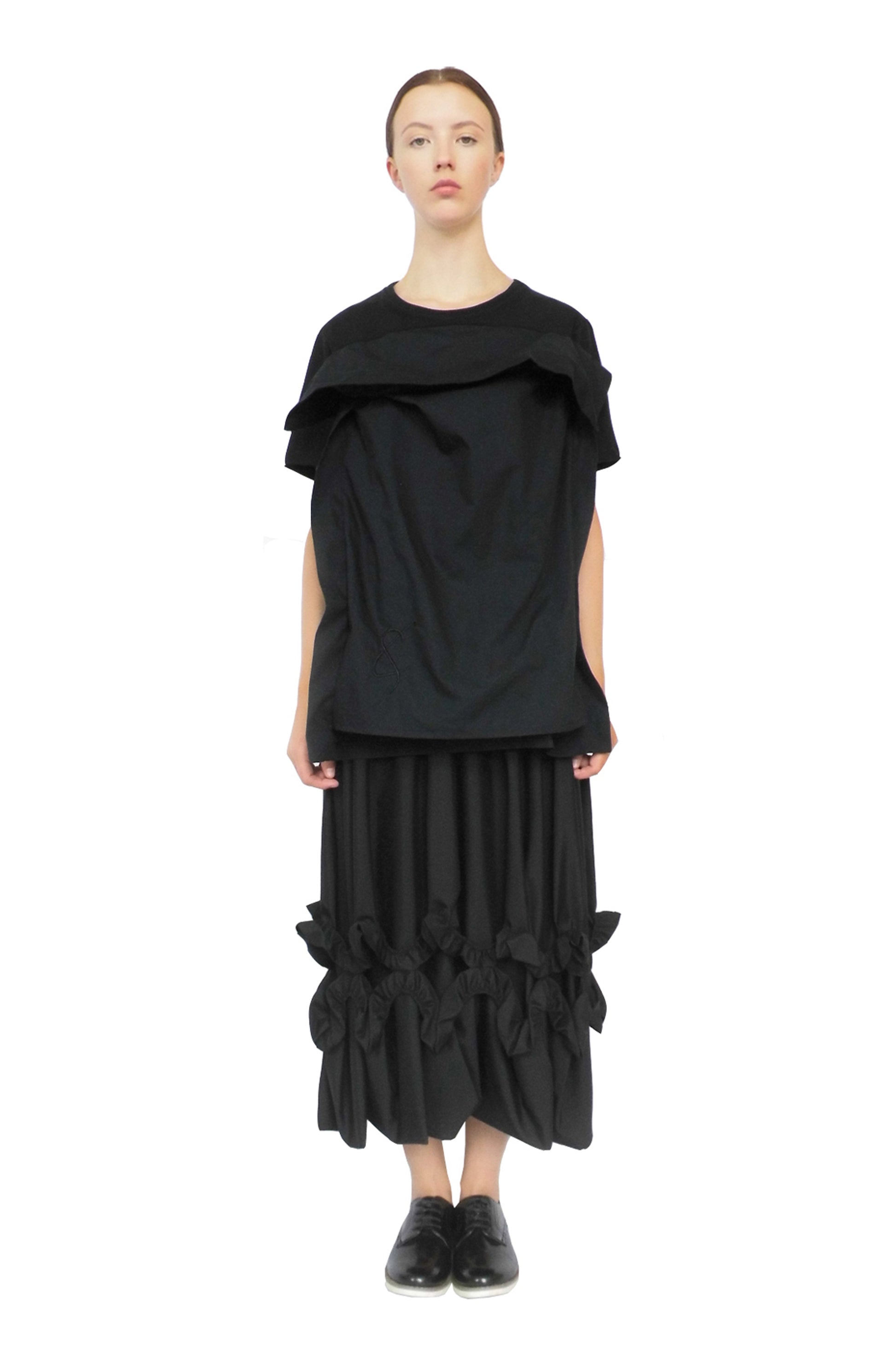 Thought-provoking black pillow top dress designed to raise mental health awareness and diversity
