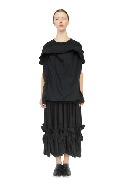 Thought-provoking black pillow top dress designed to raise mental health awareness and diversity