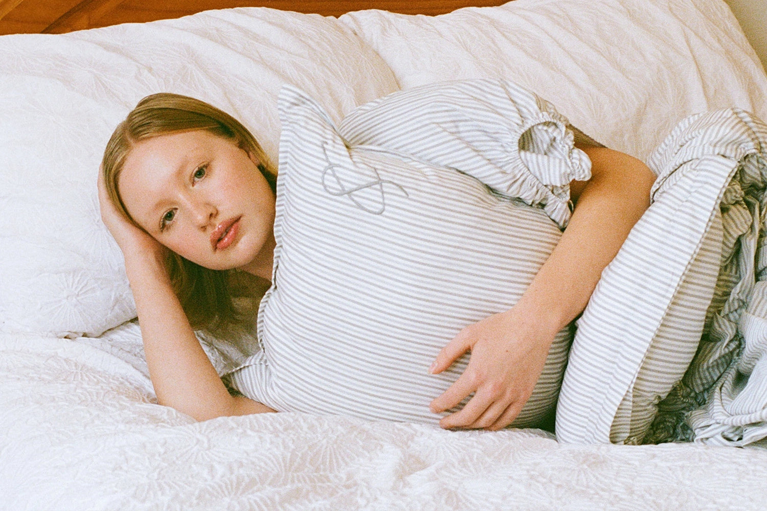 Model wearing a pillow top by luxury fashion brand Cunnington & Sanderson based in Yorkshire