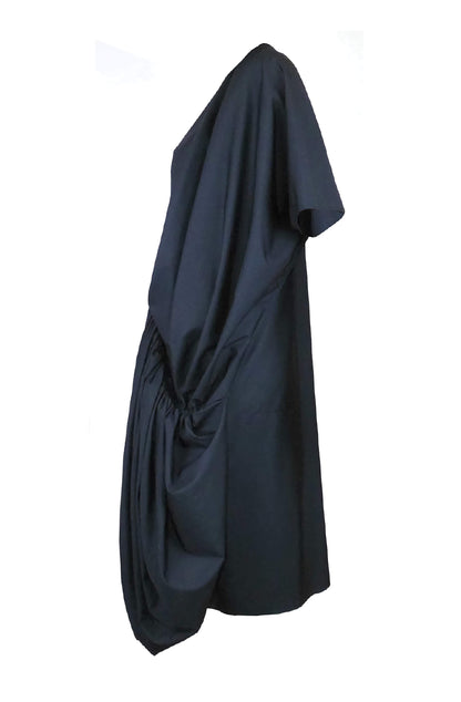 Zero-waste cotton rosette dress with sculptural draping and raglan sleeves, 100% fabric utilization made in UK