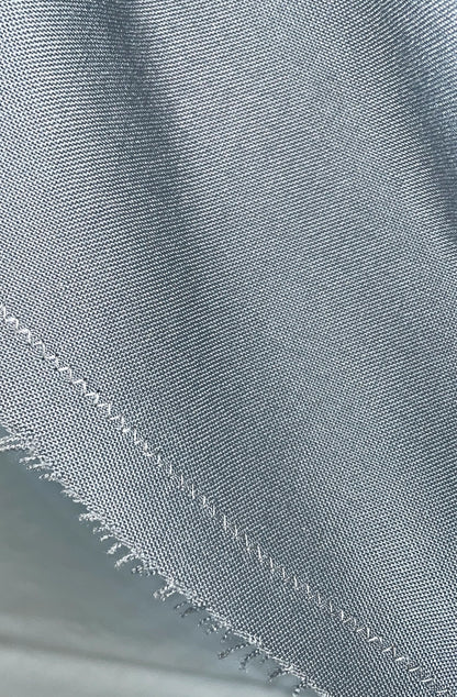 Close-up of raw edge detail on hidden pocket skirt, sustainable zero-waste construction
