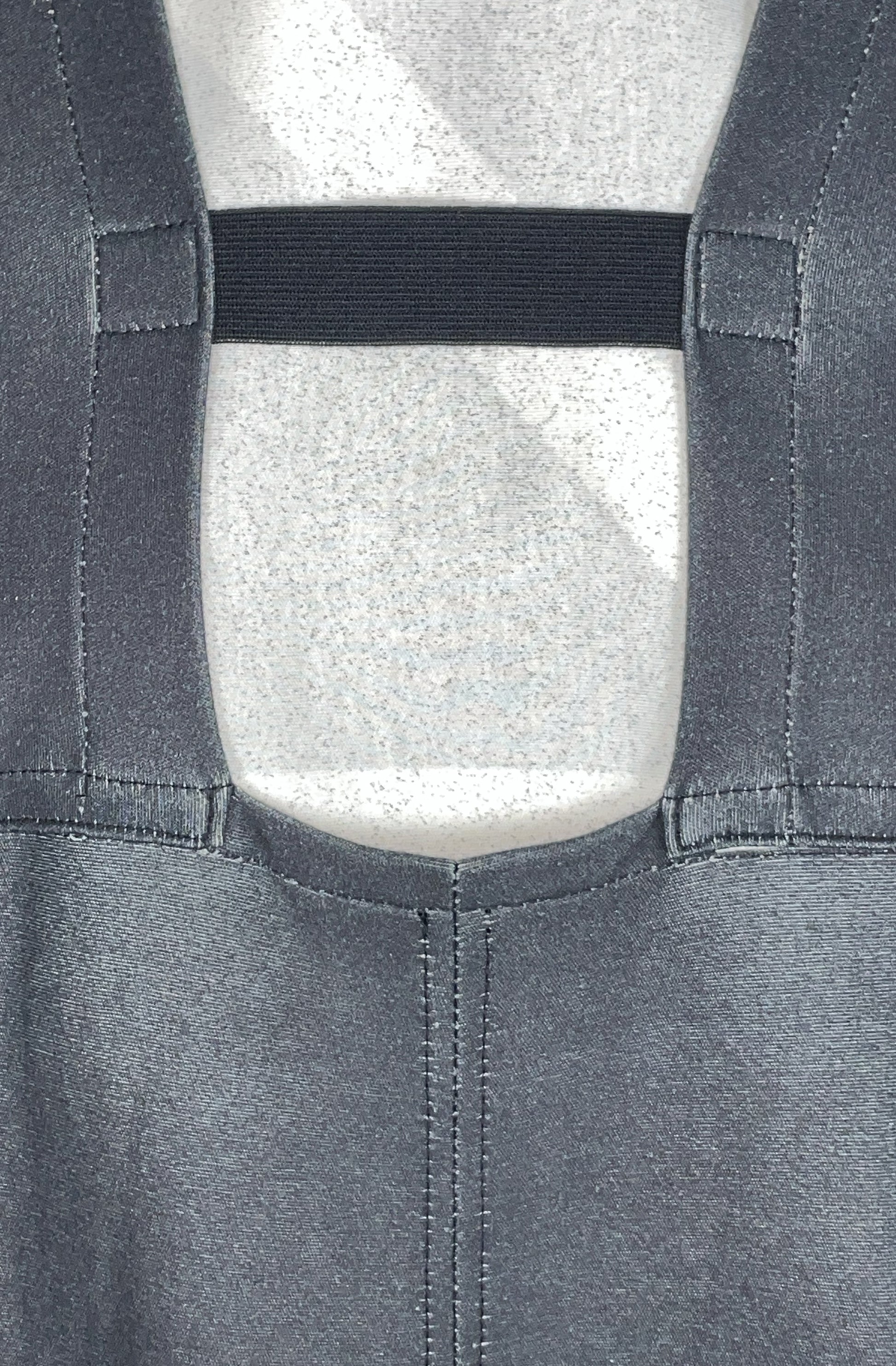 Close-up of zero waste black dress with organic elasticated back band close up detail