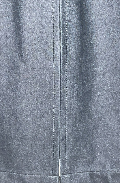 Close-up of the zero waste dress black organic cotton fabric texture back vent