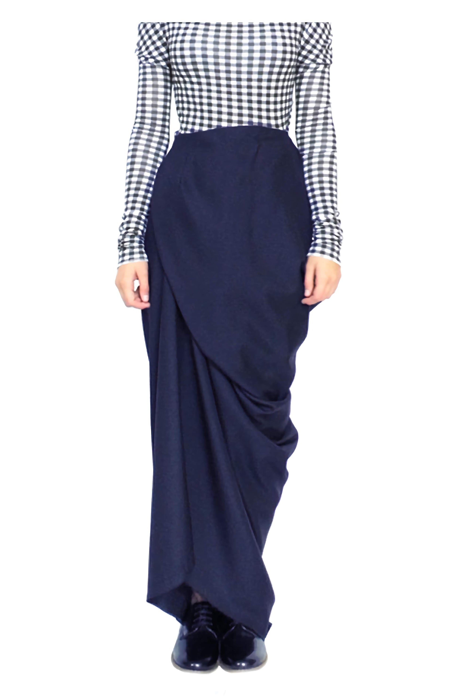 Asymmetrical long draped full length wrap skirt in a zero waste sustainable fashion design.